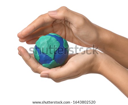 Female hands with model of Earth on white background