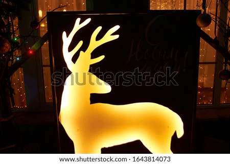 Christmas decorations with a glowing deer