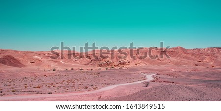 Mars planet style concept picture of desert landscape sand stone ground dry wasteland scenic view rocky hills horizon background warm region copy space