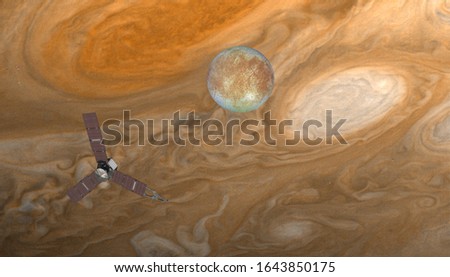 Juno spacecraft with jupiter on the foreground Jupiter's Satellite Europa "Elements of this image furnished by NASA "  
