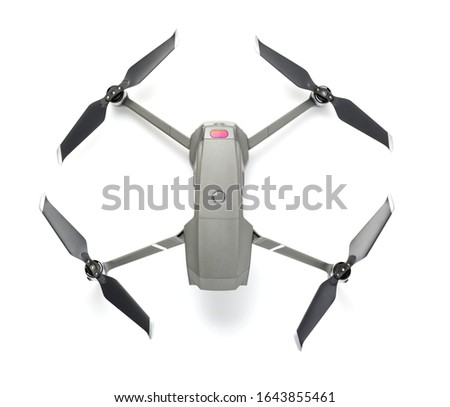 Modern drone quadcopter with a camera isolated on white background. Top view