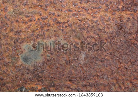 Brown, black and yellow rust and dirt on white enamel. Rusted brown and white abstract texture. Corroded white metal background. Rusty metal surface with streaks of rust. Rusty corrosion.