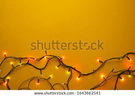 copy space with multicolored garland on the colorful background, design fore text