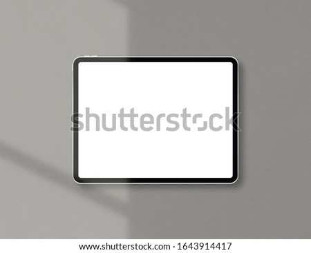 Modern tablet with blank white screen. Mockup scene. Tablet mockup with soft light. Photo mockup with clipping path.