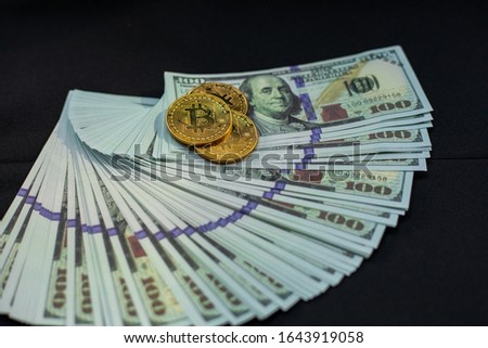 US banknote with Bitcoin on black background