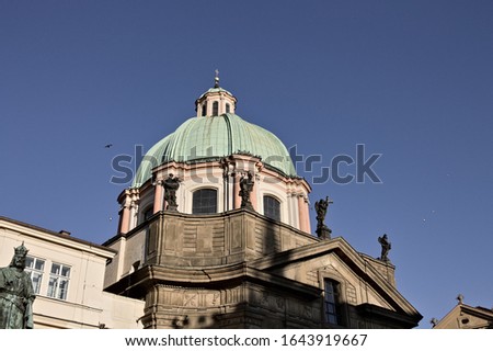 A green dome of an old baroque church with pink columns (Prague, Czech Republic, Europe)