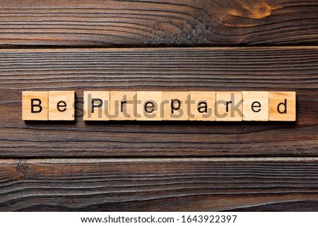 BE PREPARED word written on wood block. BE PREPARED text on wooden table for your desing, concept. Royalty-Free Stock Photo #1643922397