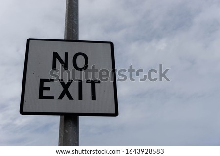 A black and white no exit sign