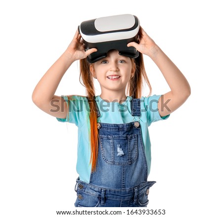 Little girl with virtual reality glasses on white background