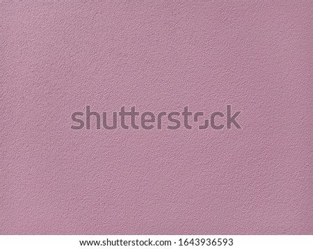 The background is made of pink colored concrete.