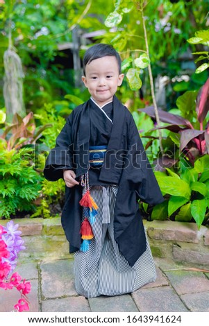 asian little boy Wearing yukata in graden