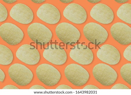 Flat lay potato chips pattern on pastel background. Top view
