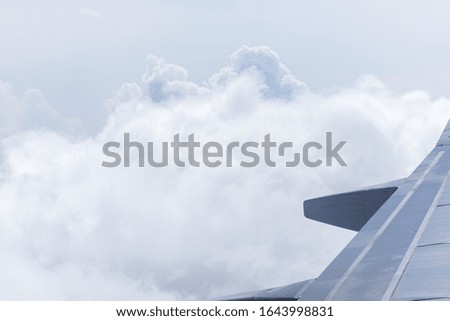 Beautiful cloudy sky from aerial view. Airplane view above clouds.
