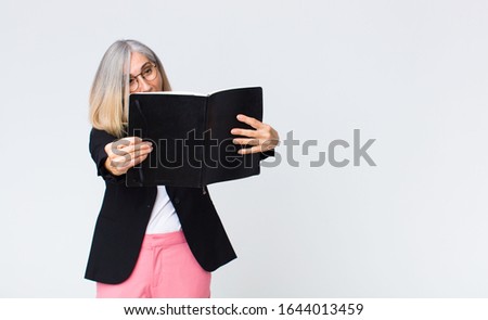 middle age businesswoman with a notebook