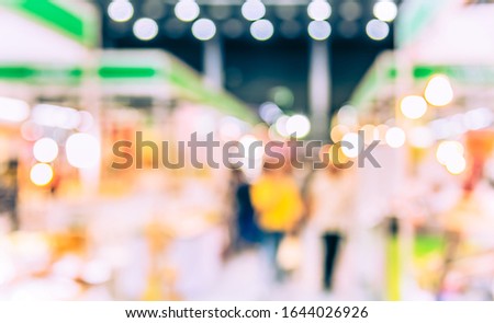 Vintage tone Abstract Blurred Shopping mall or Exhibition hall with bokeh for background usage.