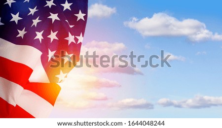 American flag on the background of the dawn sky. Top view, copy space for text.
