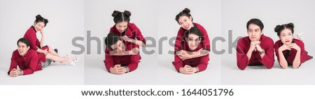 asian love couple in a red Chinese cloth lay down together showing their love to each other