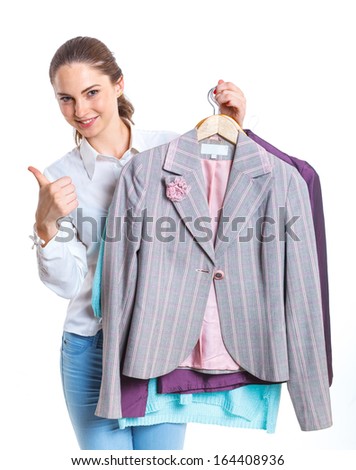 Studio picture of beautiful teenage girl with clothes. Isolated white background