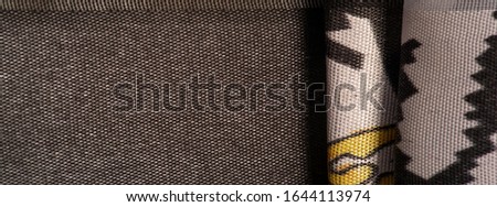 Background texture, decorative ornament, silk fabric cinnamon beige and yellow, Picturesque, graphic decoration of a combination of geometric, floral or other elements.
