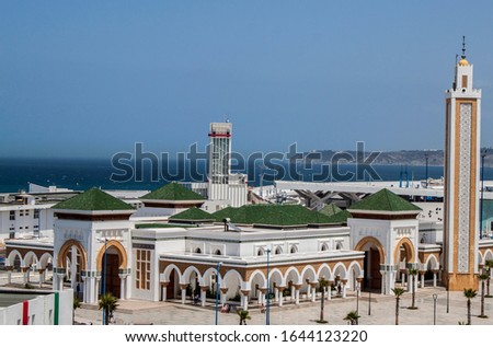 Golden tower of the Grand Mosque in the port in the historical old Medina (Jewish downtown district) in Tangier, Morocco, Africa. Royalty-Free Stock Photo #1644123220