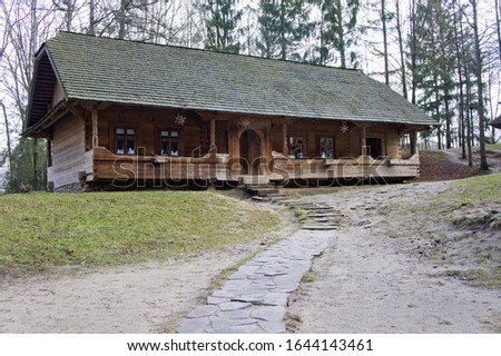 Old rural wooden houses. Background for the village. Rural architecture. Buildings made of natural materials.