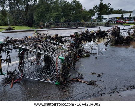 Helensvale Flooding - Siganto Drive Road Closure Debris with Trolley  