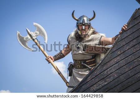 Strong Viking on his ship Royalty-Free Stock Photo #164429858