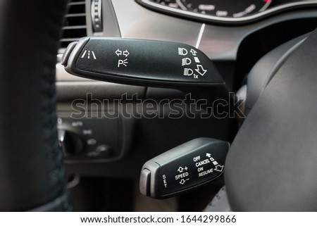 Closeup lane departure warning system LDWS and adaptive cruise control leavers close-up. Concept of reducing road hazard and improving driving safety. Royalty-Free Stock Photo #1644299866