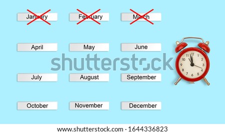 calendar autumn months and red alarm clock on blue background. Concept time Creative Top view Flat Lay Minimal style Copy space
