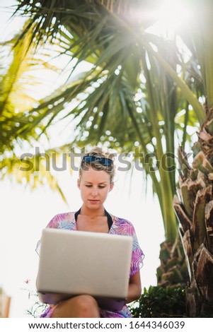 Young woman working on laptop in outdoor Mexico