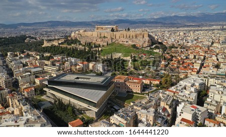 Aerial photo taken by drone of iconic new modern Acropolis museum, Acropolis hill and the Parthenon at the background, Athens historic centre, Attica, Greece Royalty-Free Stock Photo #1644441220