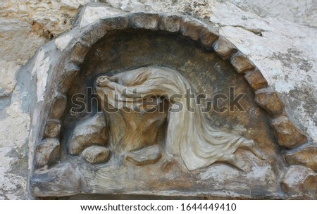  Sculpture, Jesus prayed on a rock in the Garden of Gethsemane, Jerusalem, Israel. Royalty-Free Stock Photo #1644449410