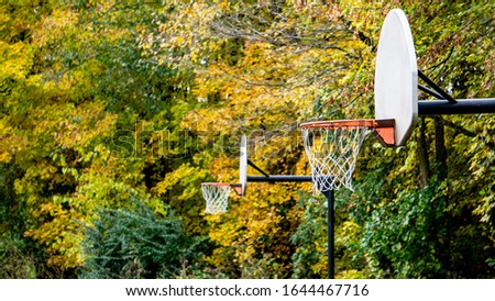 basketball hoops outdoor park youth recreational area in autumn fall