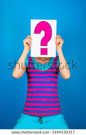 Woman Hiding her Face  Behind a Question Mark