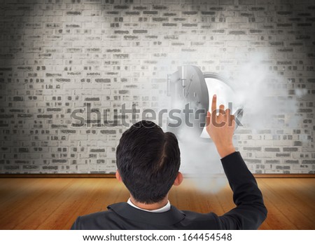 Composite image of Asian businessman pointing