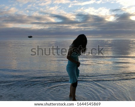 Beautiful woman standing at the seaside