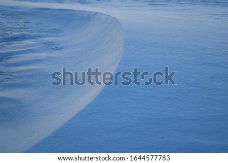 Snow drift at dusk on a frigid winter day