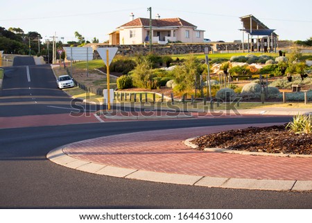 Scenic approach to Ocean Beach Bunbury Western Australia from the roundabout leading to the road on a fine sunny early morning in mid summer with landscaped gardens on one side.