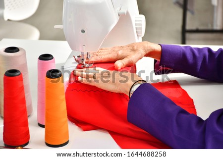 Experienced fashion designer Sewing With the equipment used in the design of clothes.