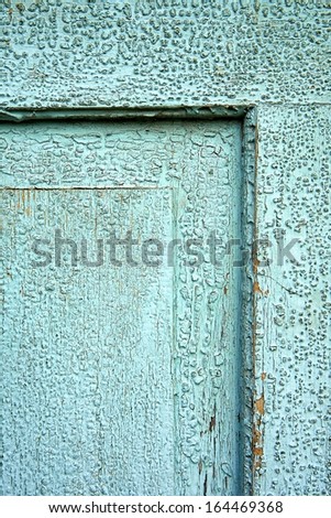 Old coat of paint on door lining