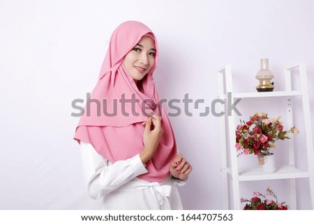 asian muslim girl wearing pink hijab with white background