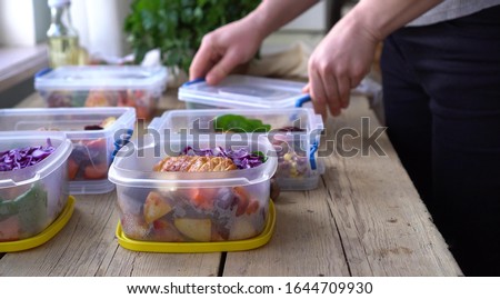 Donating on Thanksgiving day, food bank. Charity holiday dinner. Baked turkey with vegetables Royalty-Free Stock Photo #1644709930