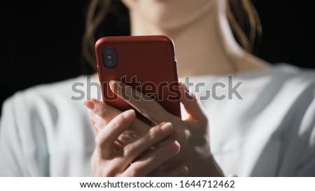 A young woman is operating a smartphone Royalty-Free Stock Photo #1644712462