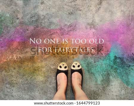 No one is too old for fairytales word and panda face shoe standing on colorful road background