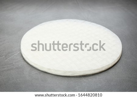 Stack of dry rice paper on grey table