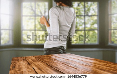Table background of free space and blurred window background in home interior