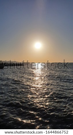 sunrise or sunset over the sea with light shadow