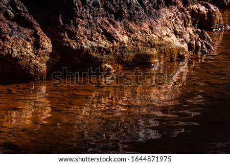 volcanic rocks covered with rust