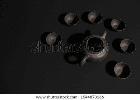 clay teapots bowls on a colored background. Chinese tea party tableware seamless Wallpaper background screensaver