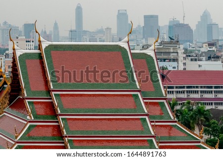 Beautiful view from Wat Saket towards the Pom Prap Sattru Phai district with the roofs of the temples of central Bangkok, Thailand Royalty-Free Stock Photo #1644891763